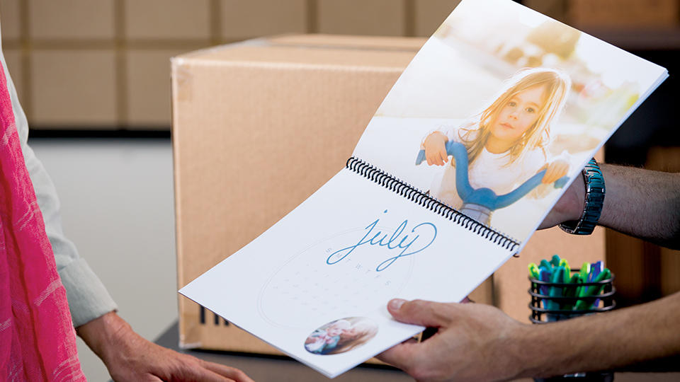 calendar being shown to customer inside the ups store