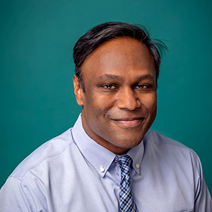 Male neurologist professional headshot.