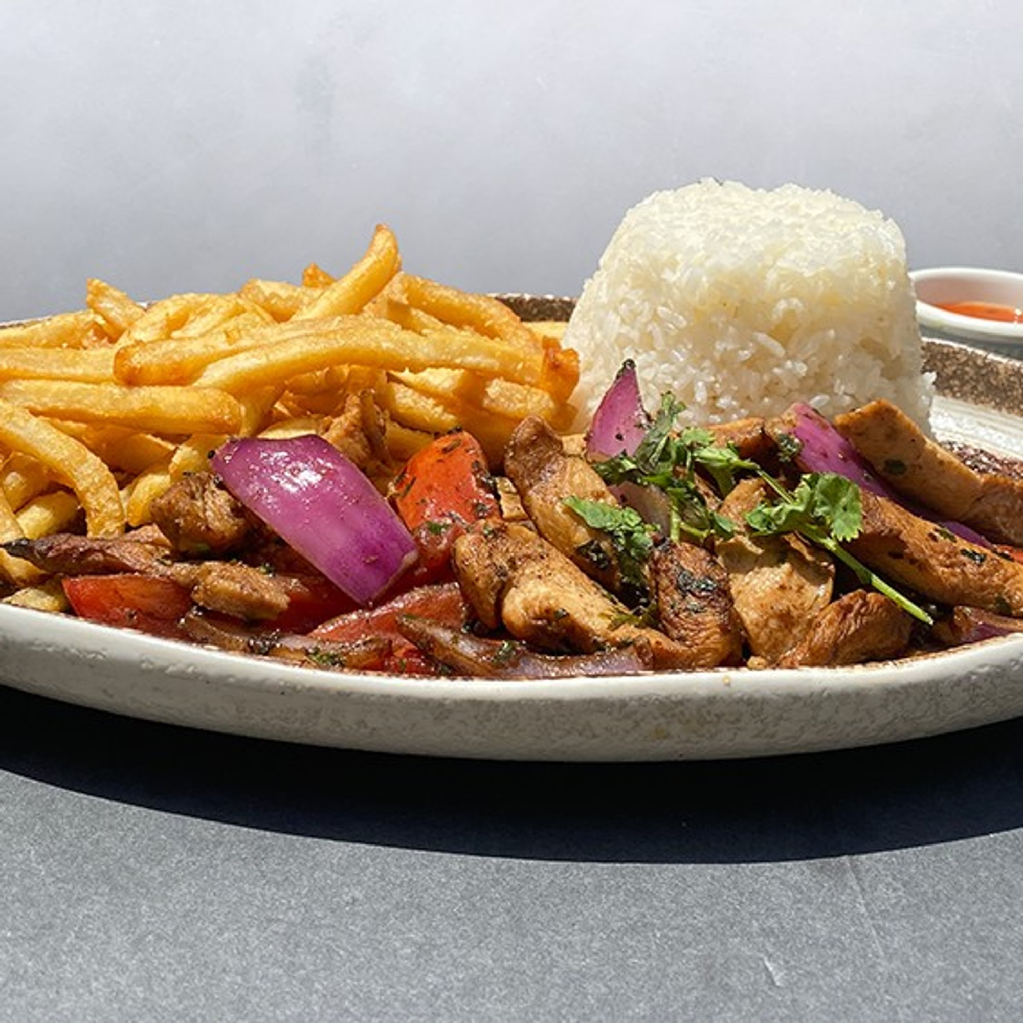 Mixto / Chicken & Beef Saltados Al Wok