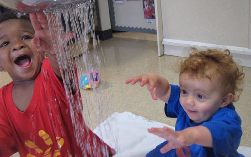 Our toddlers are learning cause and effect through water play.