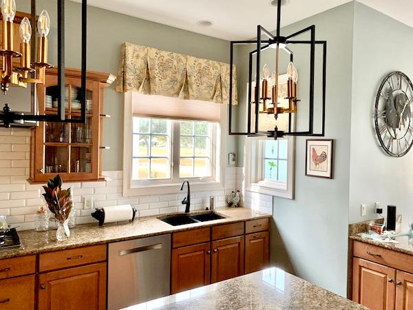 This gorgeous kitchen is the ideal intersection of contemporary and farmhouse! Our cordless cellular shades are the perfect addition to this space, making meal prep more enjoyable and effortless.