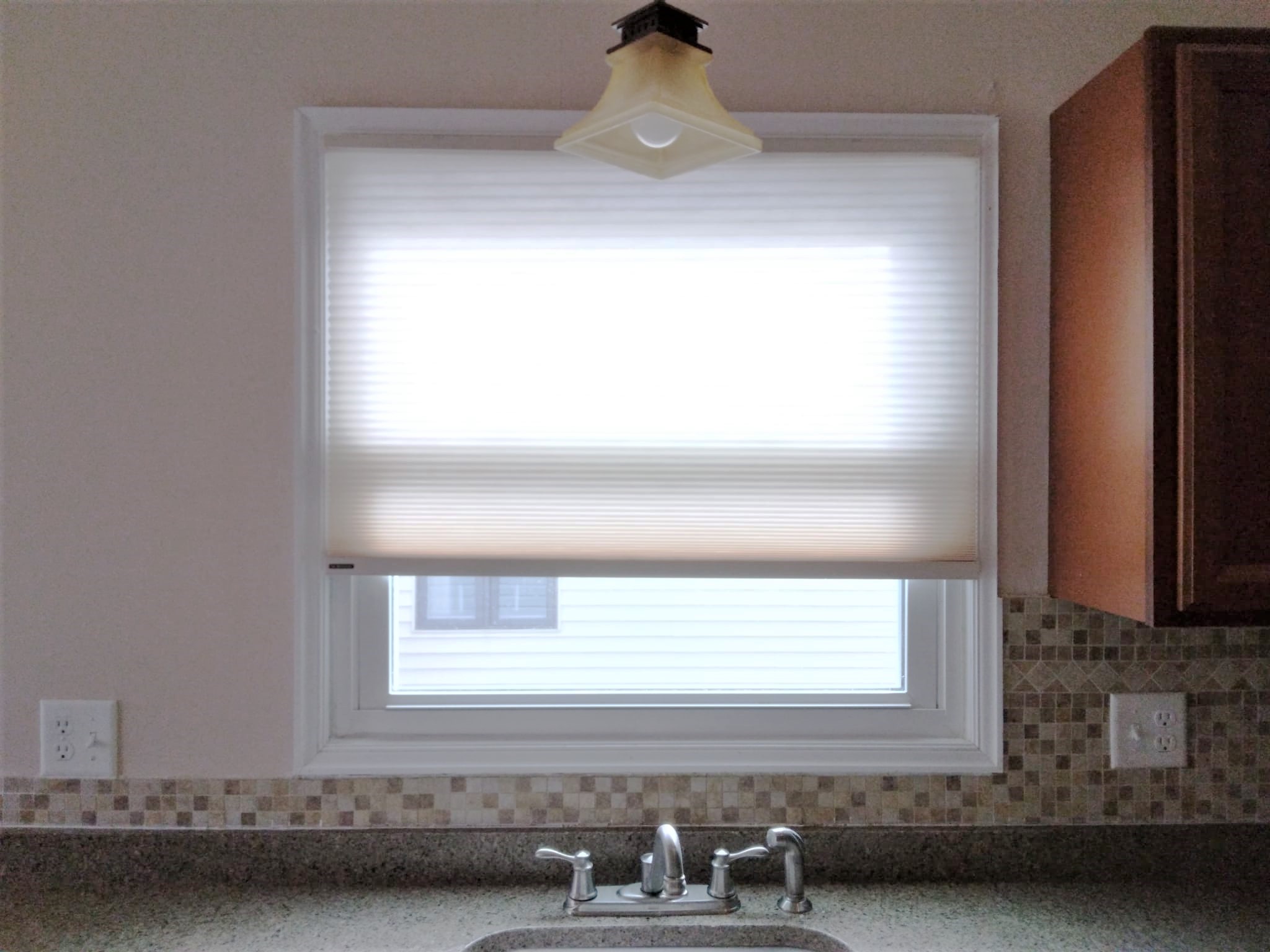 These Norman cellular shades are perfect for this Springfield Illinois kitchen. They are the perfect window covering for insulation and filtering the light coming through.   BudgetBlinds  Blinds  CellularShades  WindowCoverings  SpringfieldIllinois  Springfield