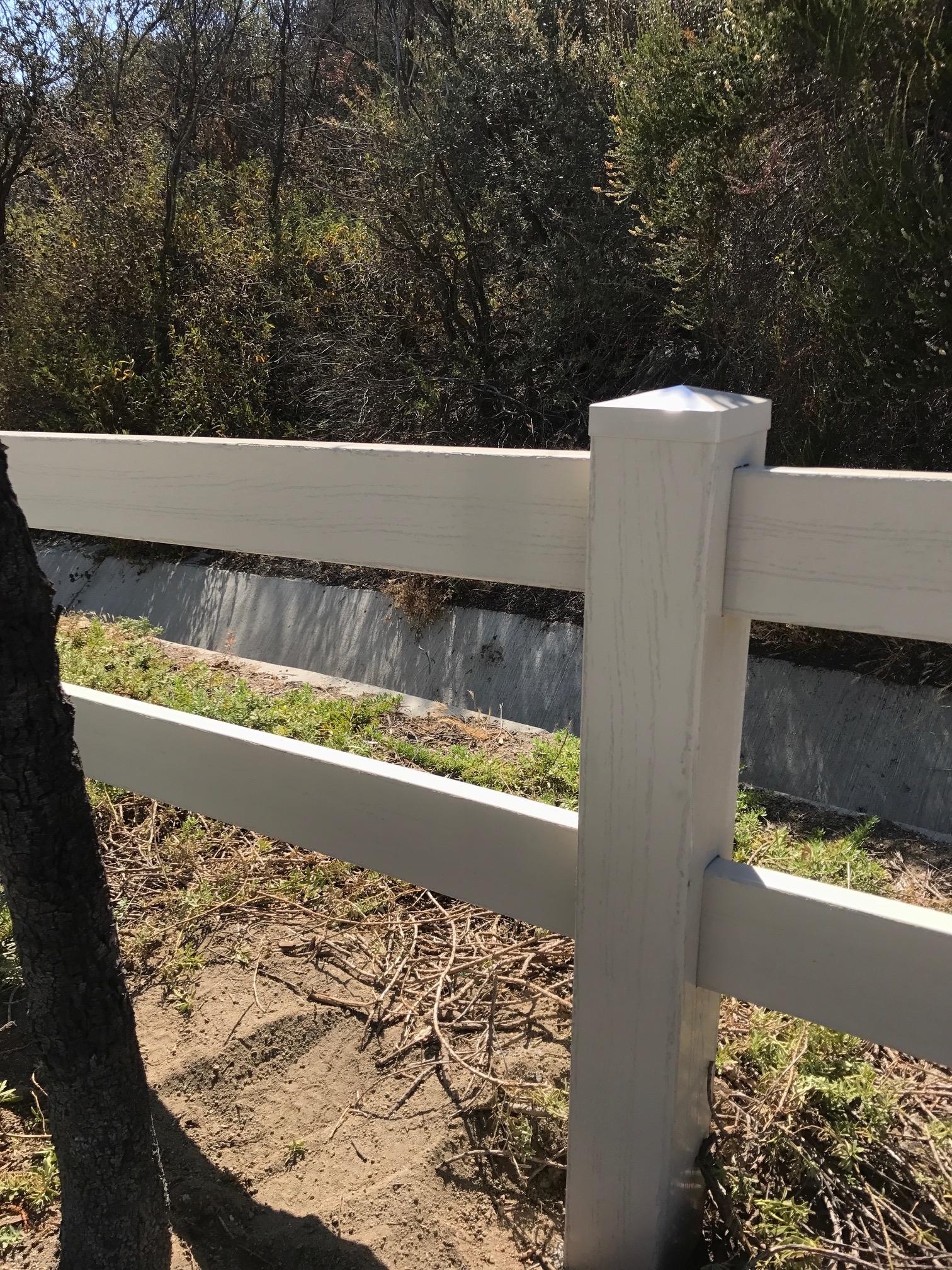 2 Rail Tan embossed Vinyl Fence installed by 3T Fence in Murrieta Ca.