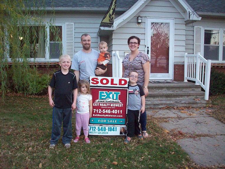 This beautiful family is very happy with their new home.