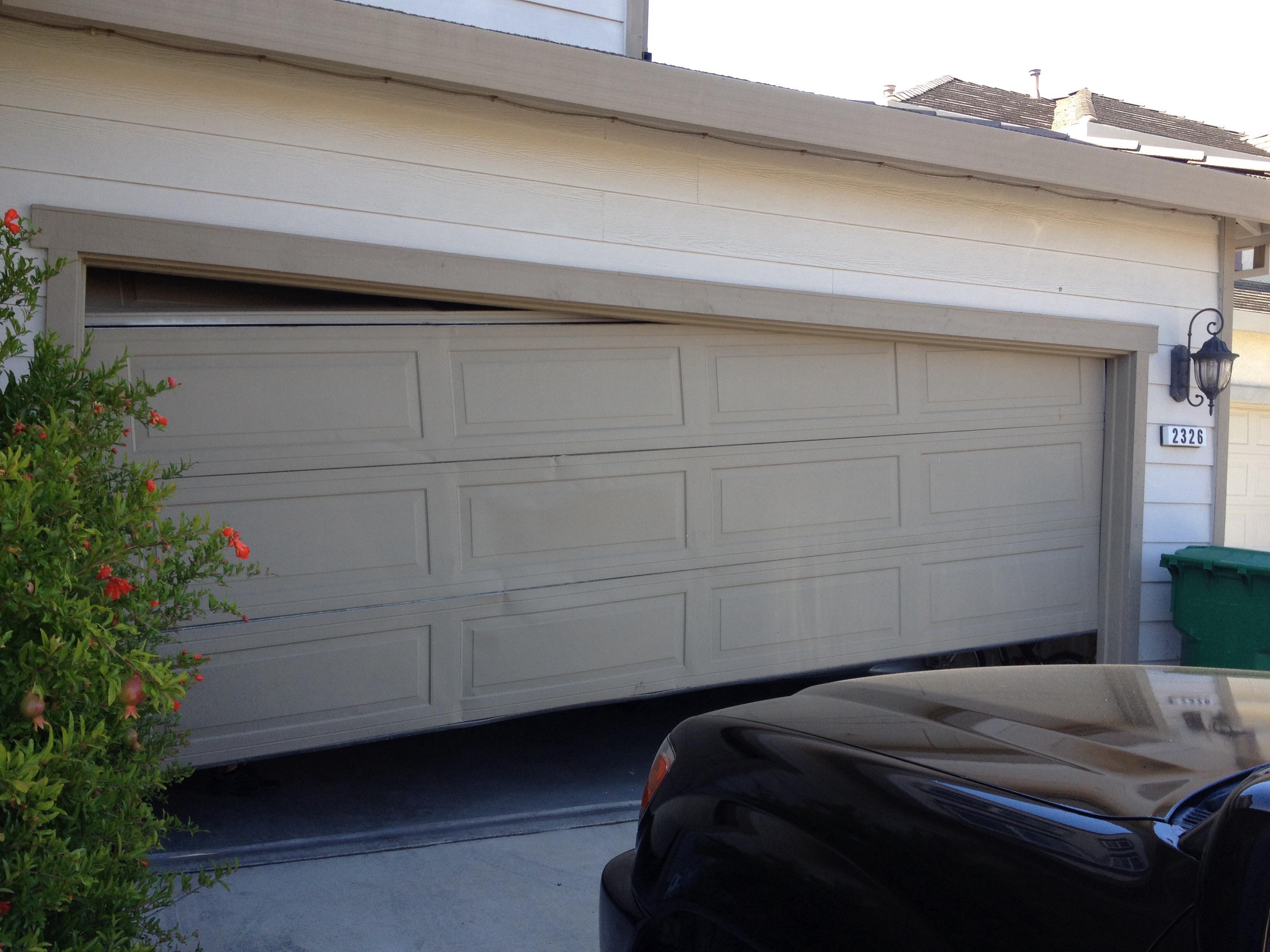 Another beaten up garage door due for a new one.