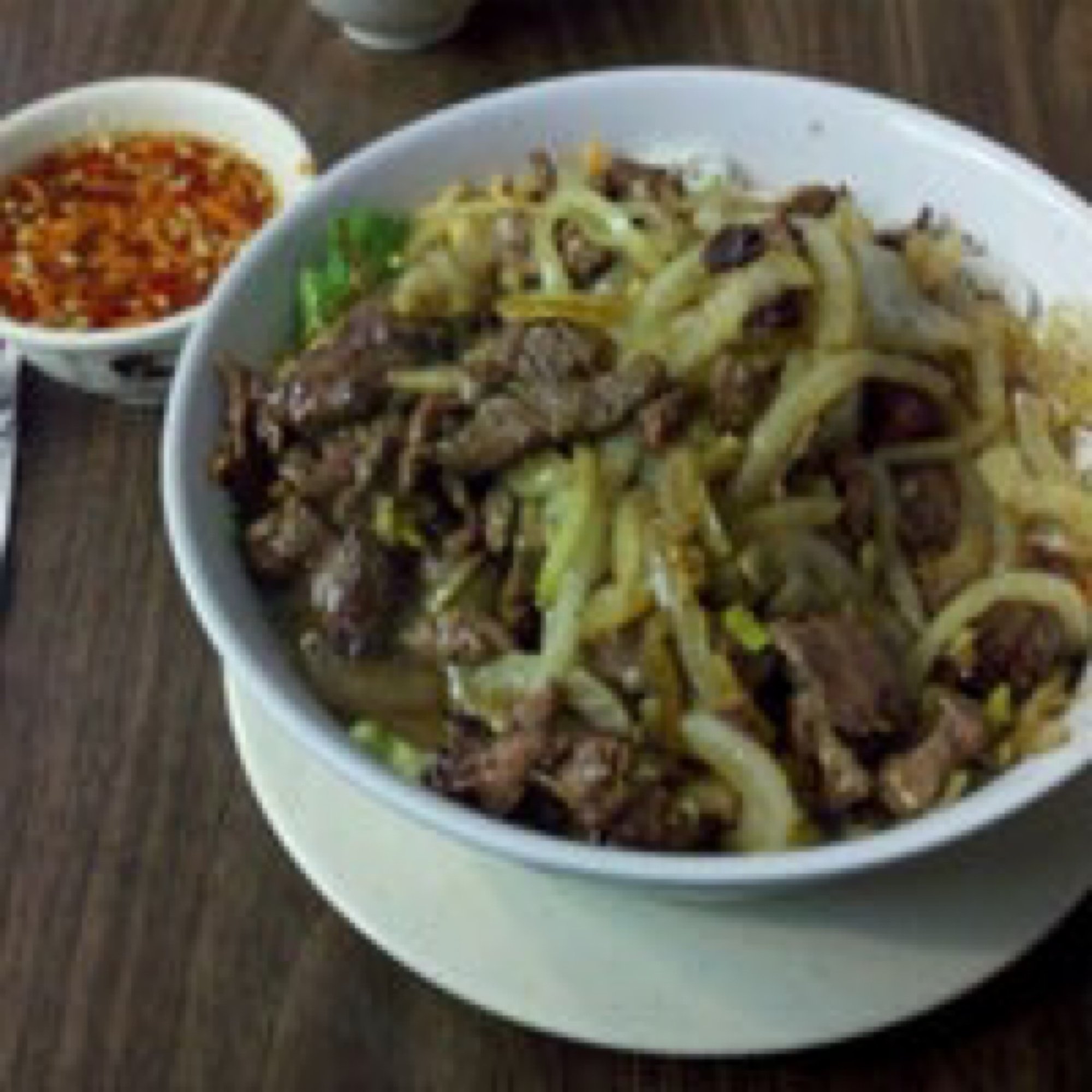 18. Beef sauteed over vermicelli - bún bò xào