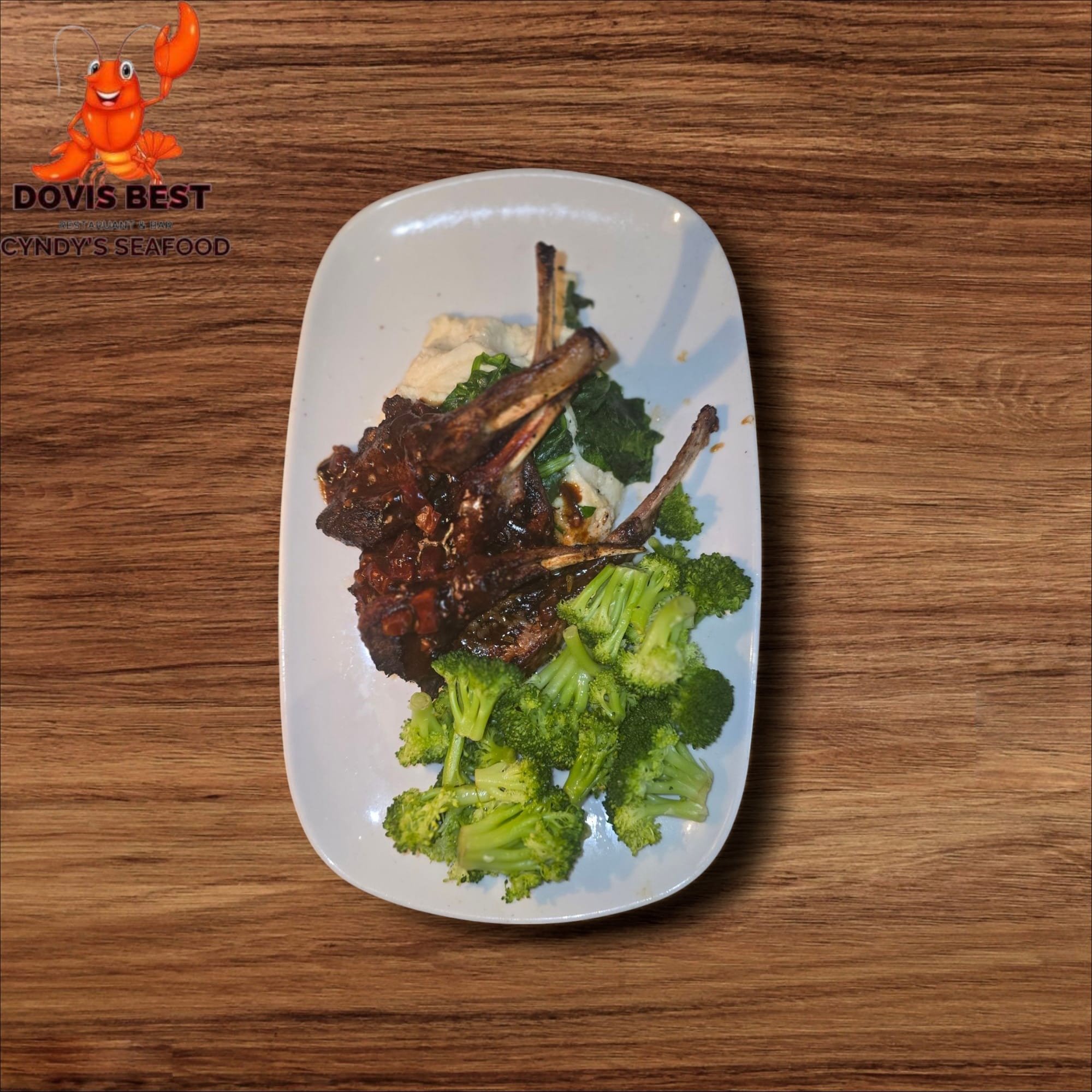 Grilled Lamb Chop with Jollof Rice and Sauteed Broccoli or Asparagus or Collard Green or Spinach