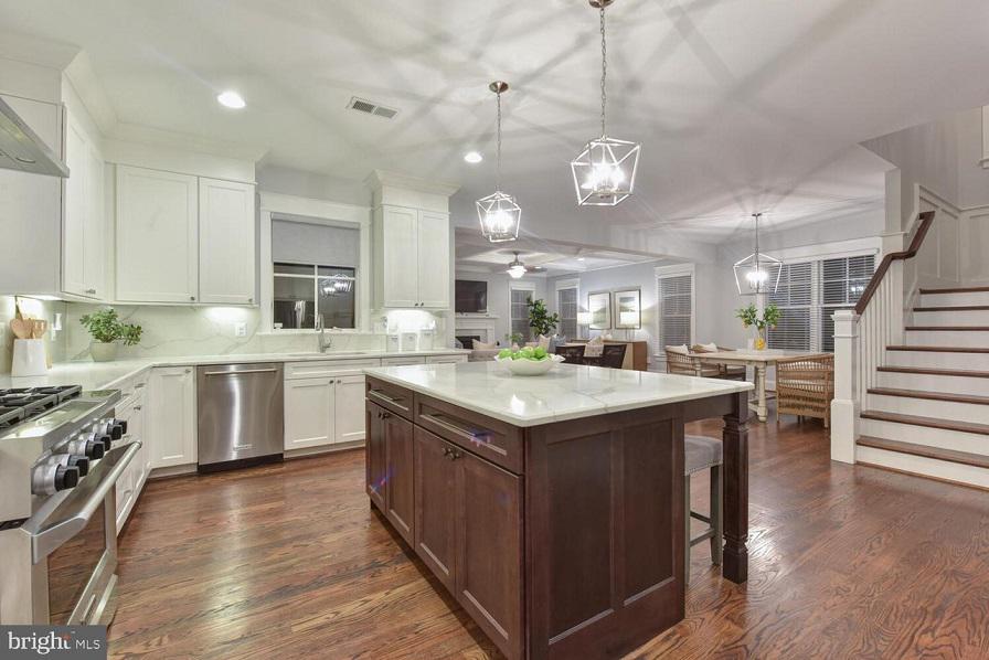 You deserve the perfect shades and blinds to match your interiors. Get a load of how great these grey Roller Shades with Wood Blinds look in this Arlington kitchen.