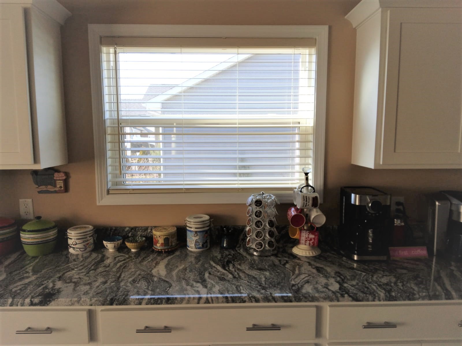 These faux wood blinds in this Springfield Illinois kitchen filter the perfect amount of light and add just the right amount of style. They are both a classic and modern window covering.  BudgetBlinds  Blinds  FauxWoodBlinds  WindowCoverings  SpringfieldIllinois  Springfield