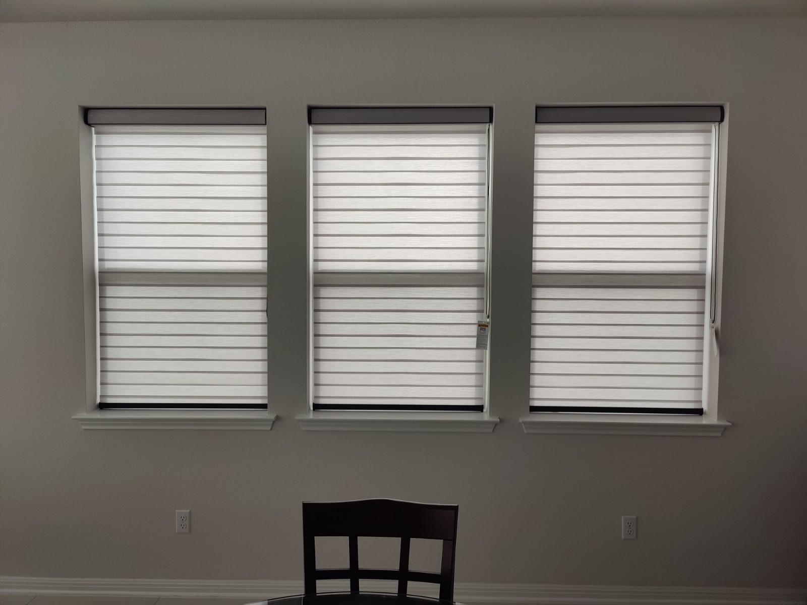 Dual sheer roller shades for a room in Leander