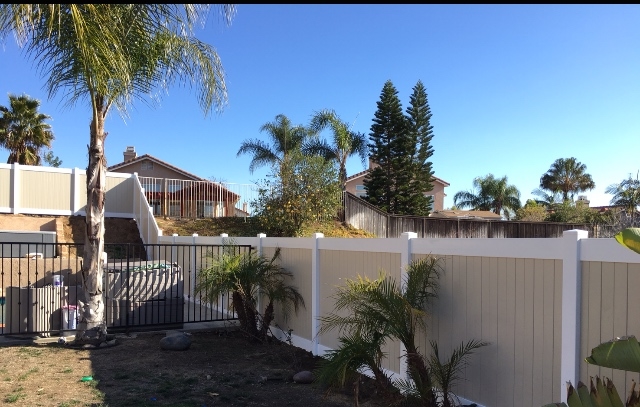 Whit and tan Vinyl Fence around pool in Moreno Valley Ca