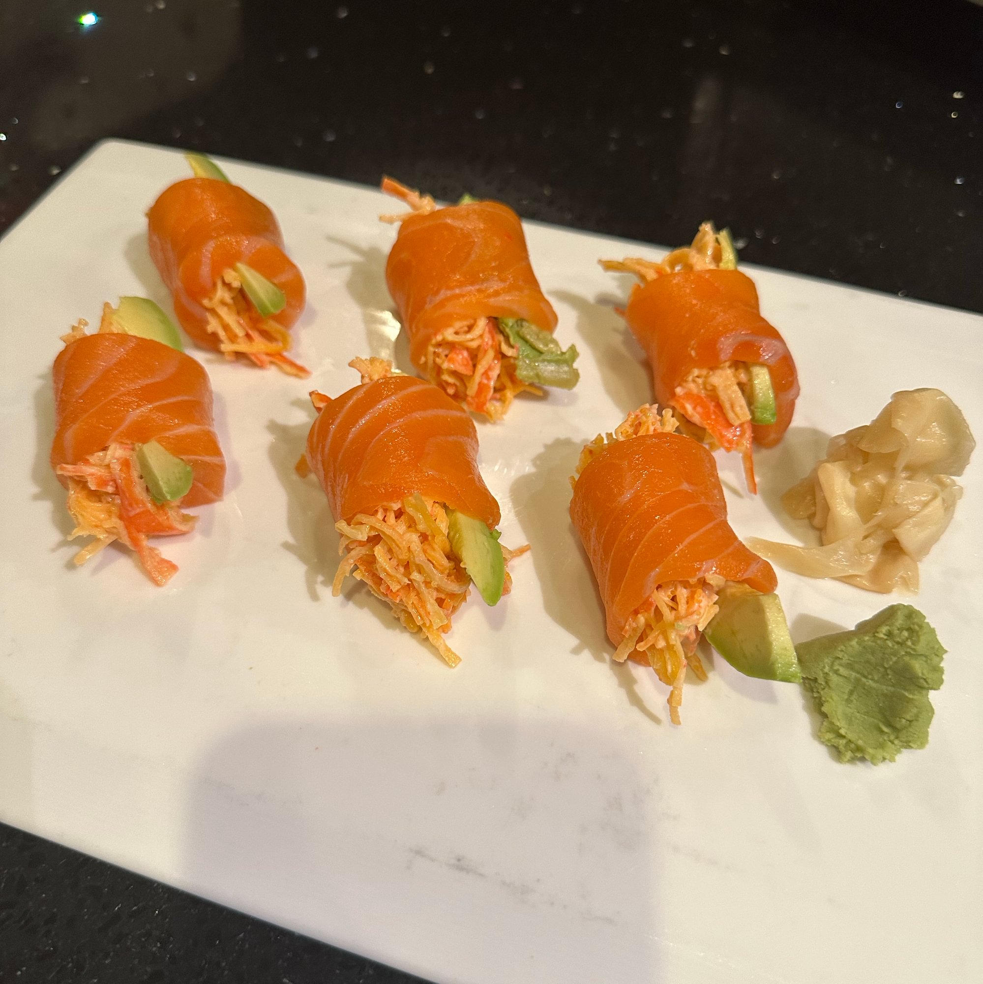 Devil Roll - Special crabs salad and avocado rolled with fresh salmon