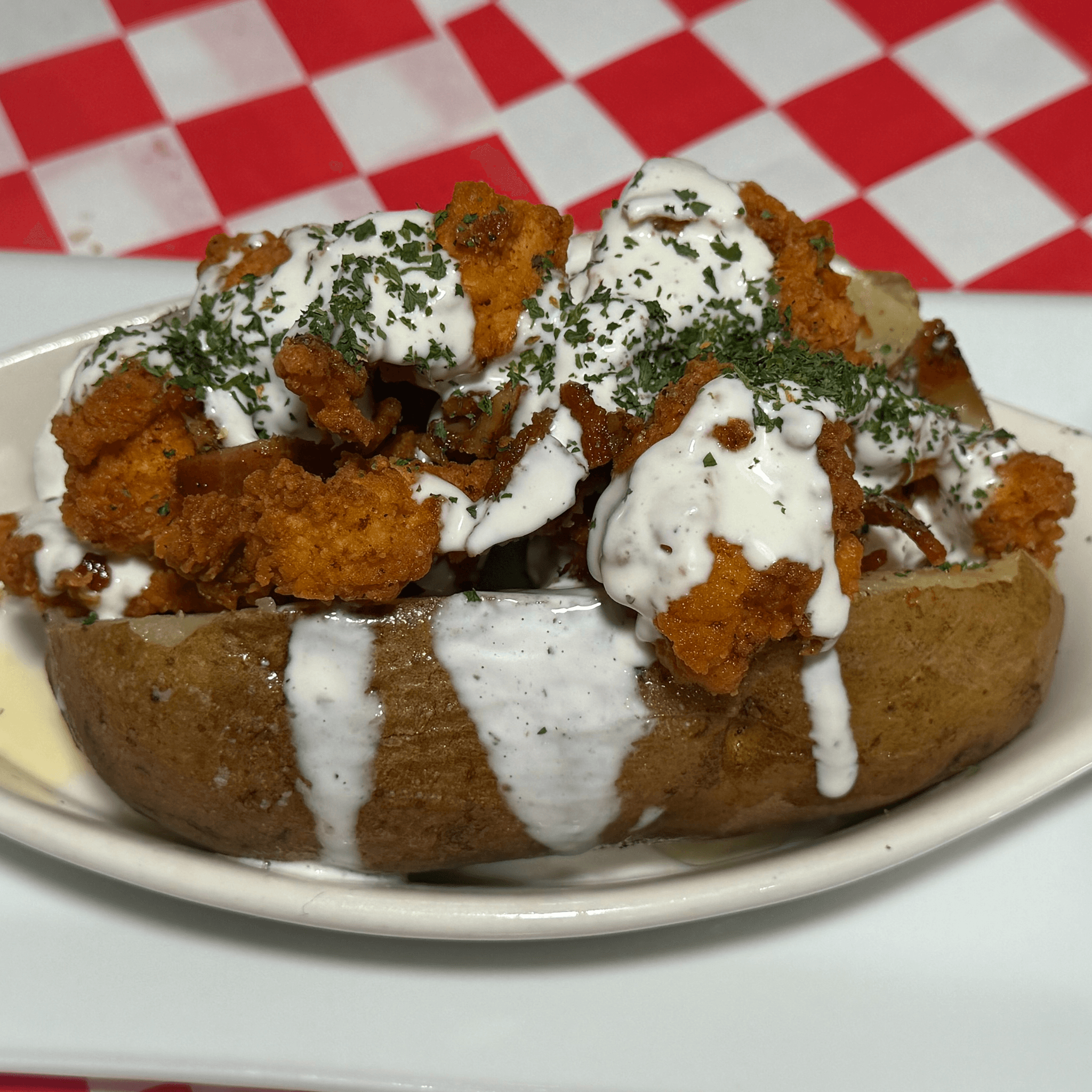Bacon, Popcorn Chicken, & Ranch Stuffed Potato