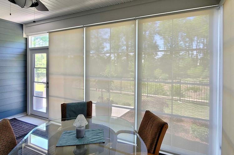 Add a porch shade to filter light that shines through large windows. This local Fuquay-Varina home is a beautiful representation of how these shades can be effective yet still attractive.