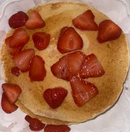 Two Pancakes with Strawberries and Whipped Cream