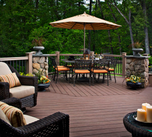 Chapel Hill deck with stone columns and deck lighting.