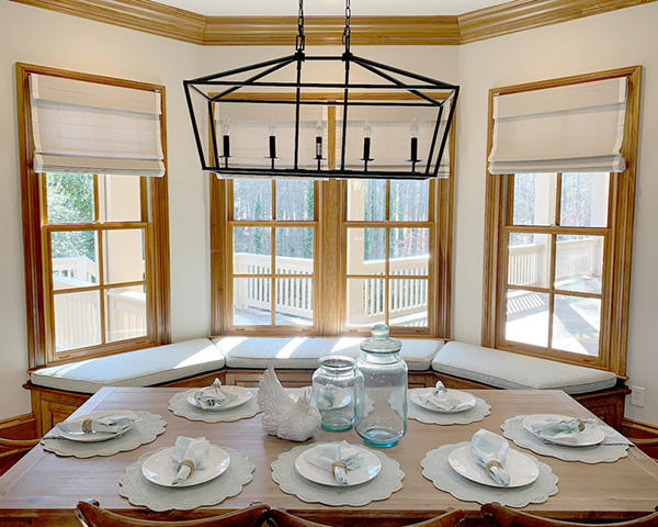 Refresh your dining room with Woven Wood shades.