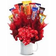 The Ultimate Candy Bouquet-Show someone special how sweet you are with this amazing candy bouquet. All your favorite candies are arranged in an impressive display within a keepsake mug. This is a unique and tasty gift that is sure to make their day. Candy Varieties may vary.