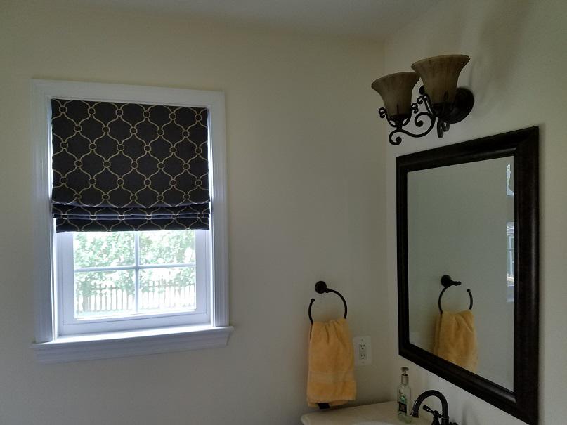 This bathroom had a Patterned Roman Shade installed to add privacy but also made it the cutest bathroom around with the added deÌcor!  BudgetBlindsArlingtonAlexandria  PatternedRomanShades  WindowWednesday  FreeConsultation