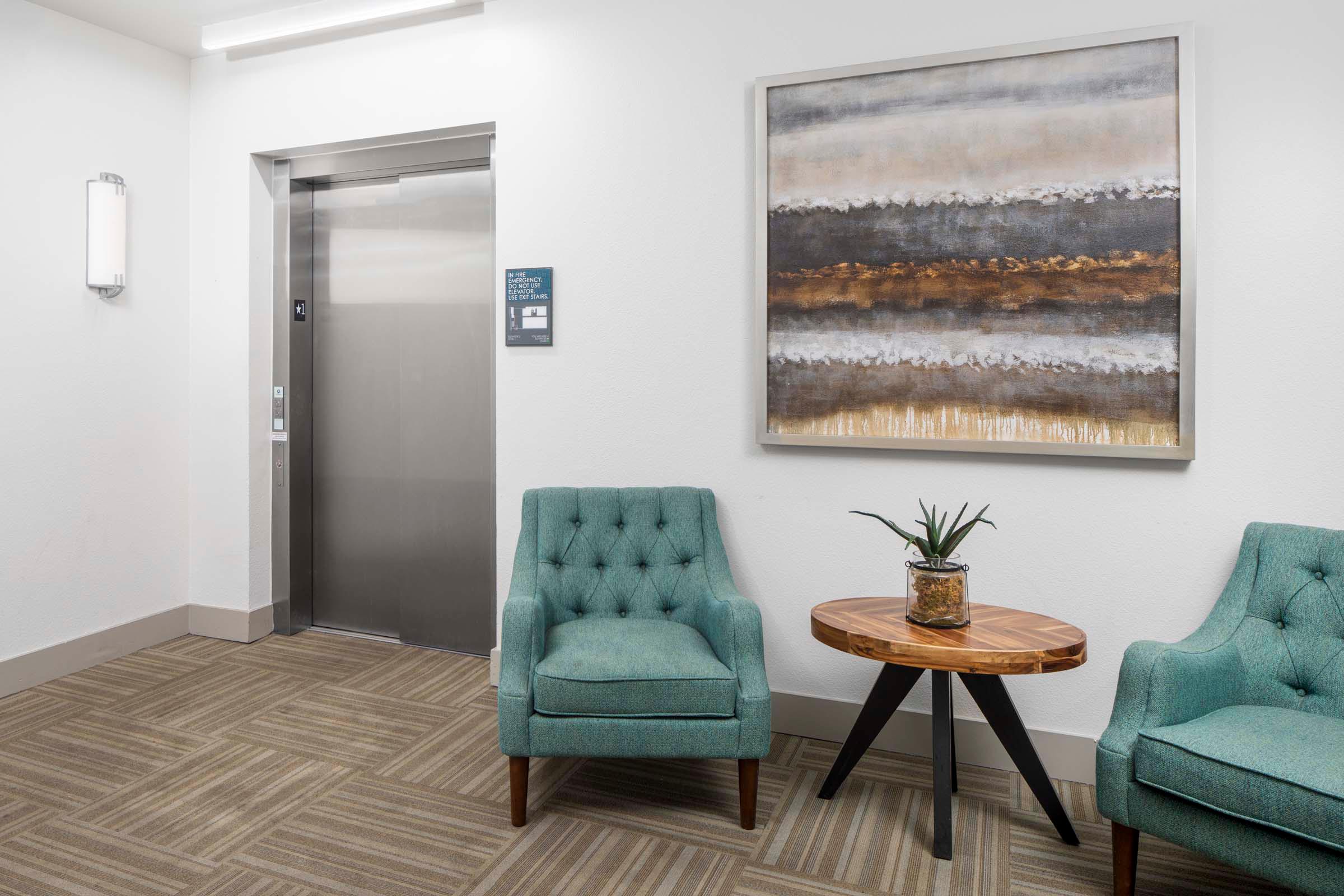 Elevator lobby with seating at Camden Greenville