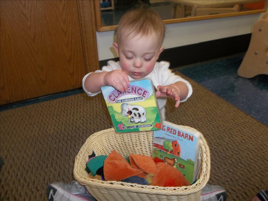 Having fun exploring our Infant discovery basket; learning all about the farm and it's animals!