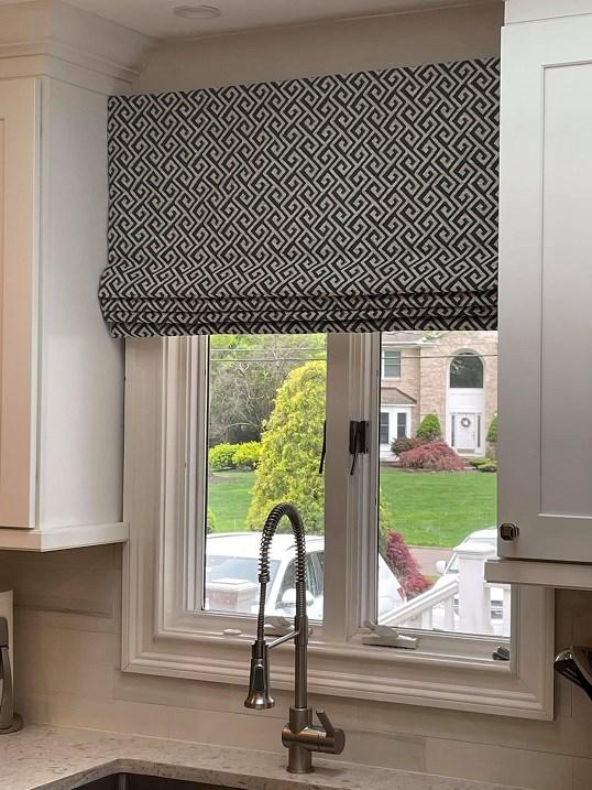 We are in love with this Roman Shade!!! Window treatments can dress up any space. Call Budget Blinds today for your custom shades!