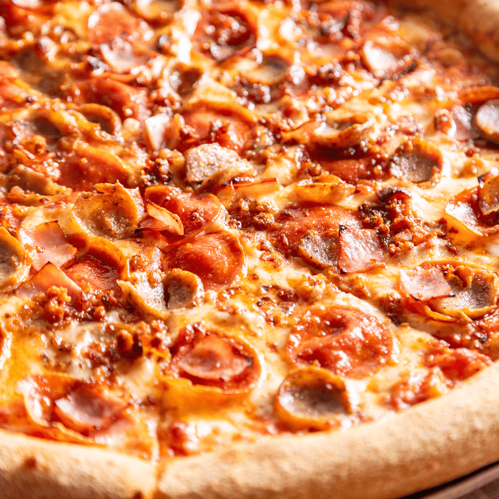 Meat lovers pizza slice