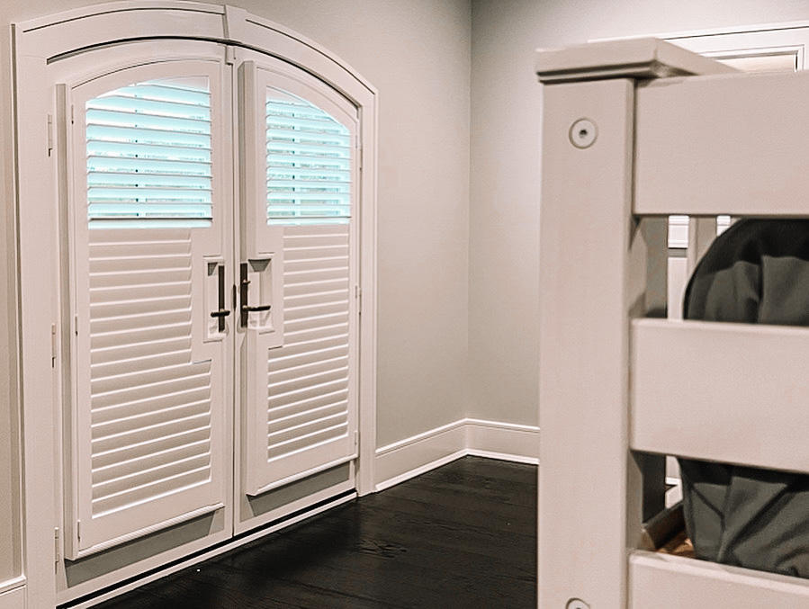 Our specialty is tackling specialty projects of all kinds! We love how these arched French Door shutters turned out in this awesome kids bedroom. The shutters accentuate the beautiful shape of the door while providing light and privacy control.