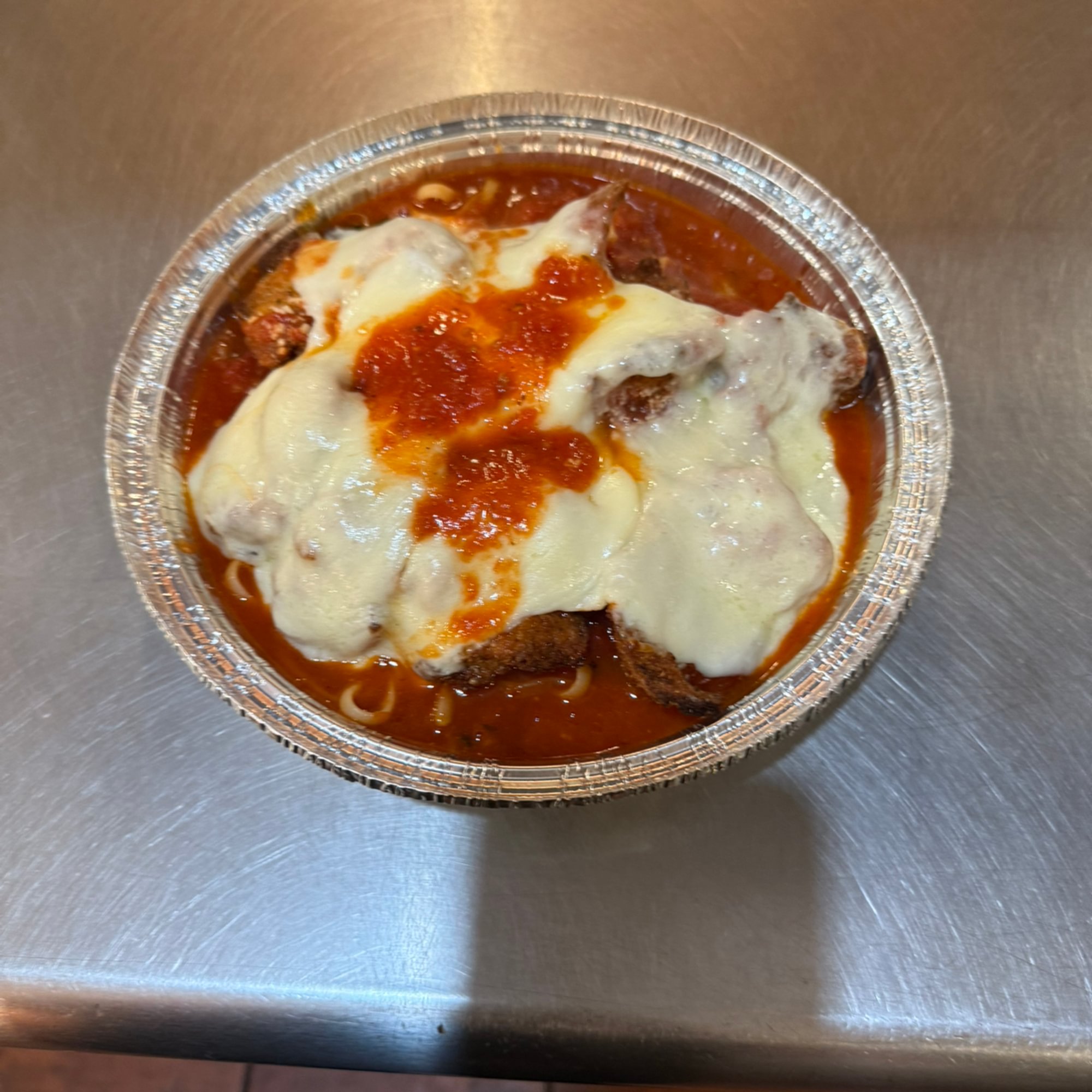 Chicken Parmesan over Linguini