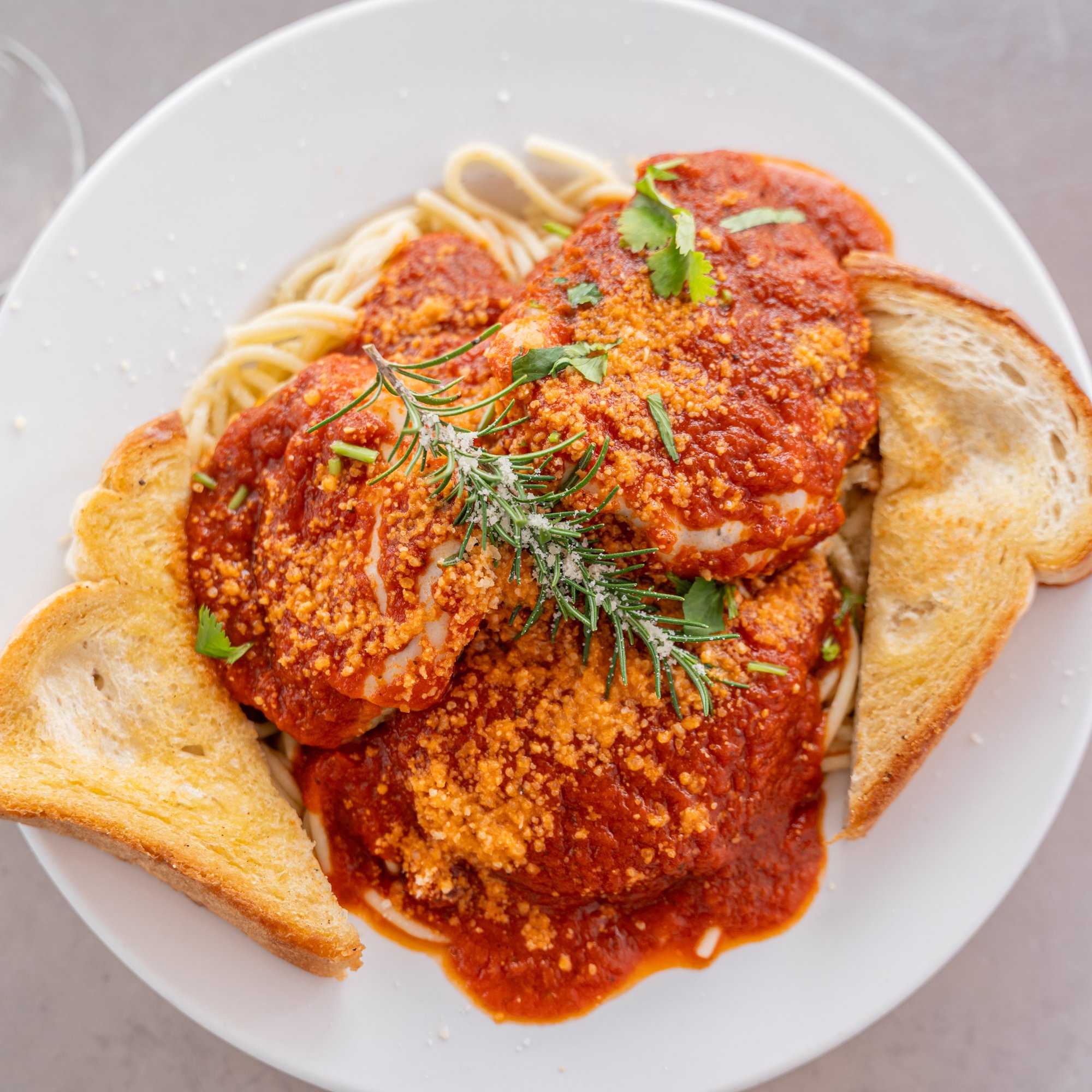Chicken Parmesan Over Spaghetti
