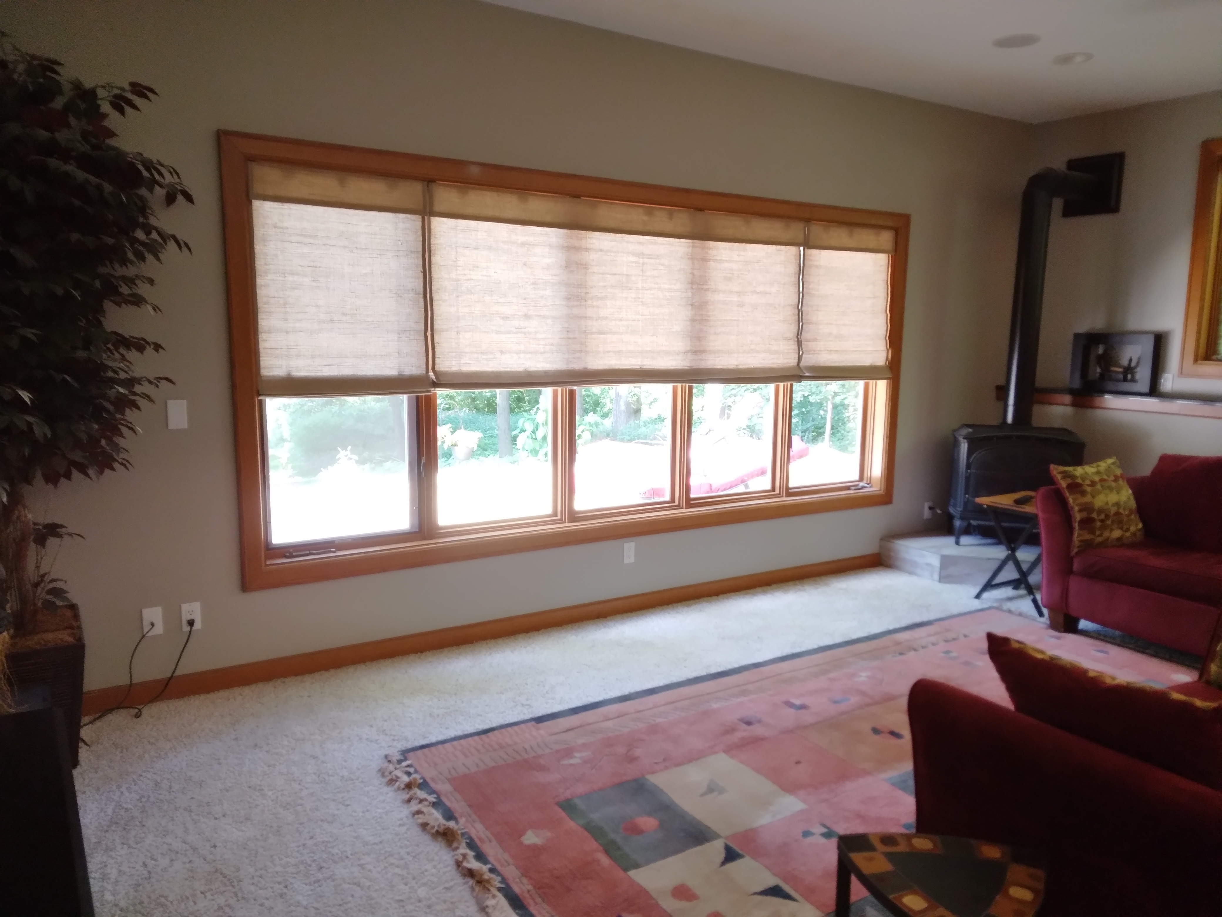 Cordless, light-filtering natural shades in Springfield Illinois living room.  BudgetBlinds  WindowCoverings  NaturalShades  SpringfieldIllinois