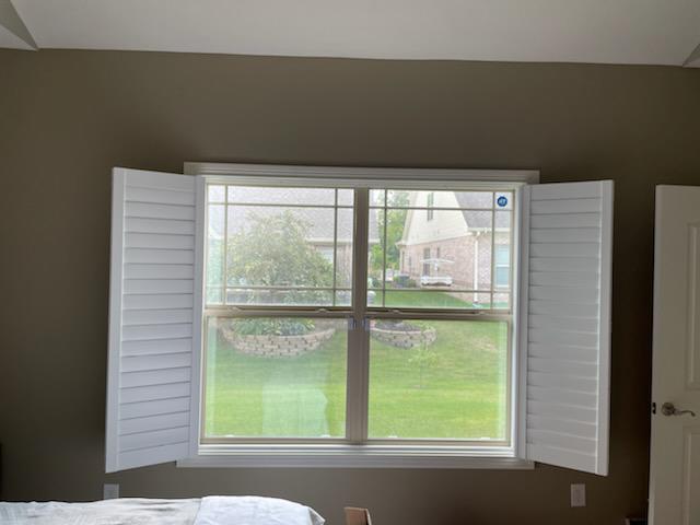 Imagine waking up every morning in this Plainfield bedroom and throwing these beautiful Shutters open! That's one reason why we installed them here-and the good looks are another!