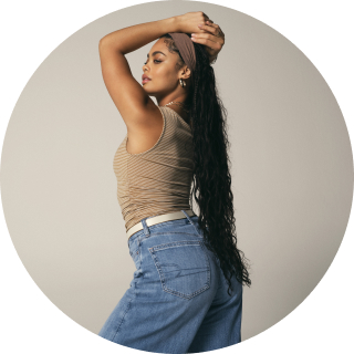 woman wearing jeans and tank top