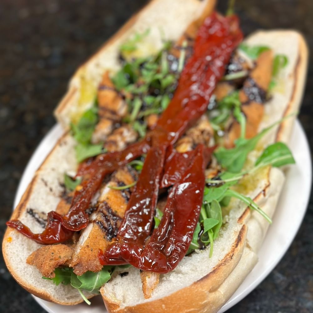 New Chicken Hero fresh Mozzarella, Sundried Peppers, Arugula, Balsamic Glaze