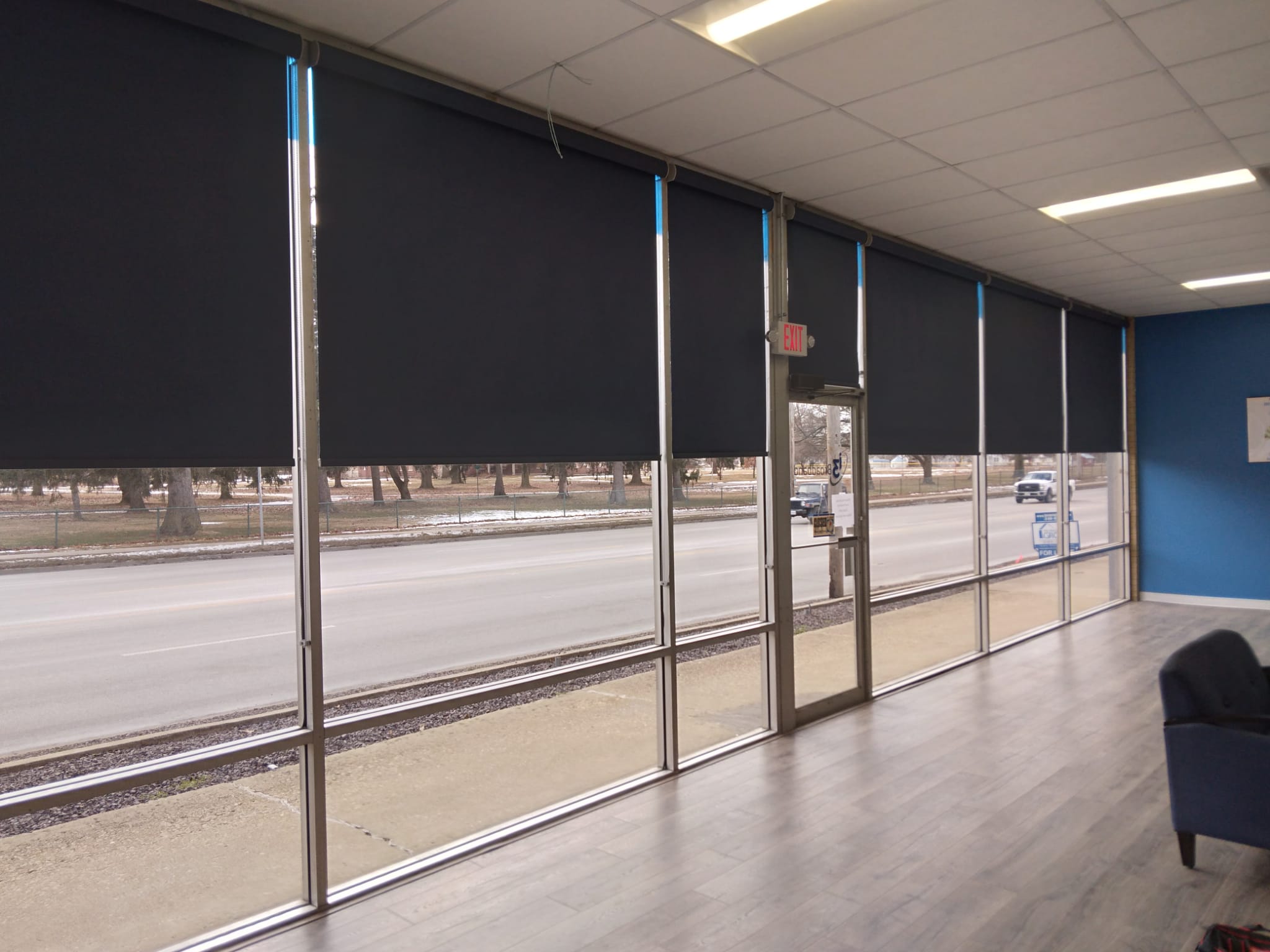These roller shades look perfect in this Jacksonville Illinois storefront commercial setting.   BudgetBlinds  Blinds  Shades  WindowCoverings  SpringfieldIllinois  Springfield