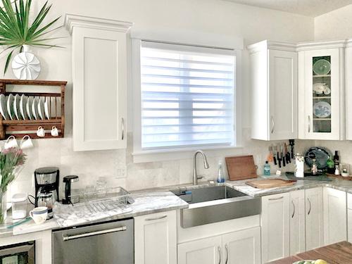 Clean and bright? Yes, please! Our sheer shades add the perfect chic appearance to this modern, radiant kitchen. Not only are these window treatments a timeless, elegant choice, but they are also a great option for larger windows!