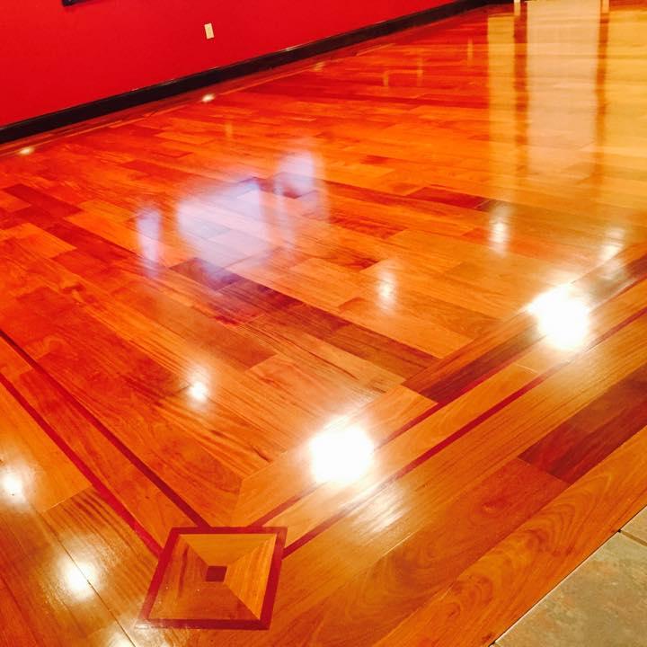 Brazillian cherry with custom border installation, 4 coats of polyurethane clear coat satin.