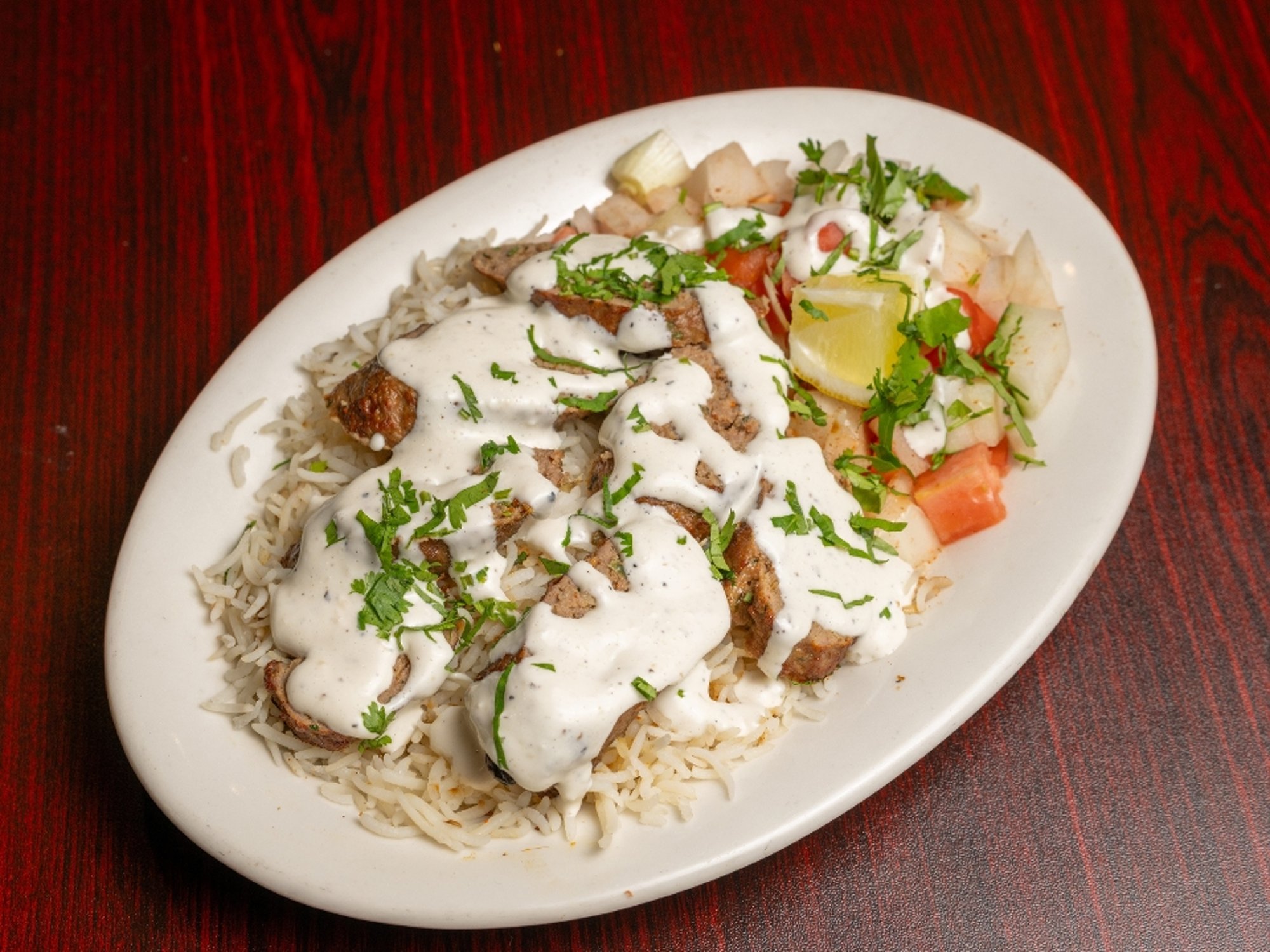 Lamb Seekh Kabob Over Rice