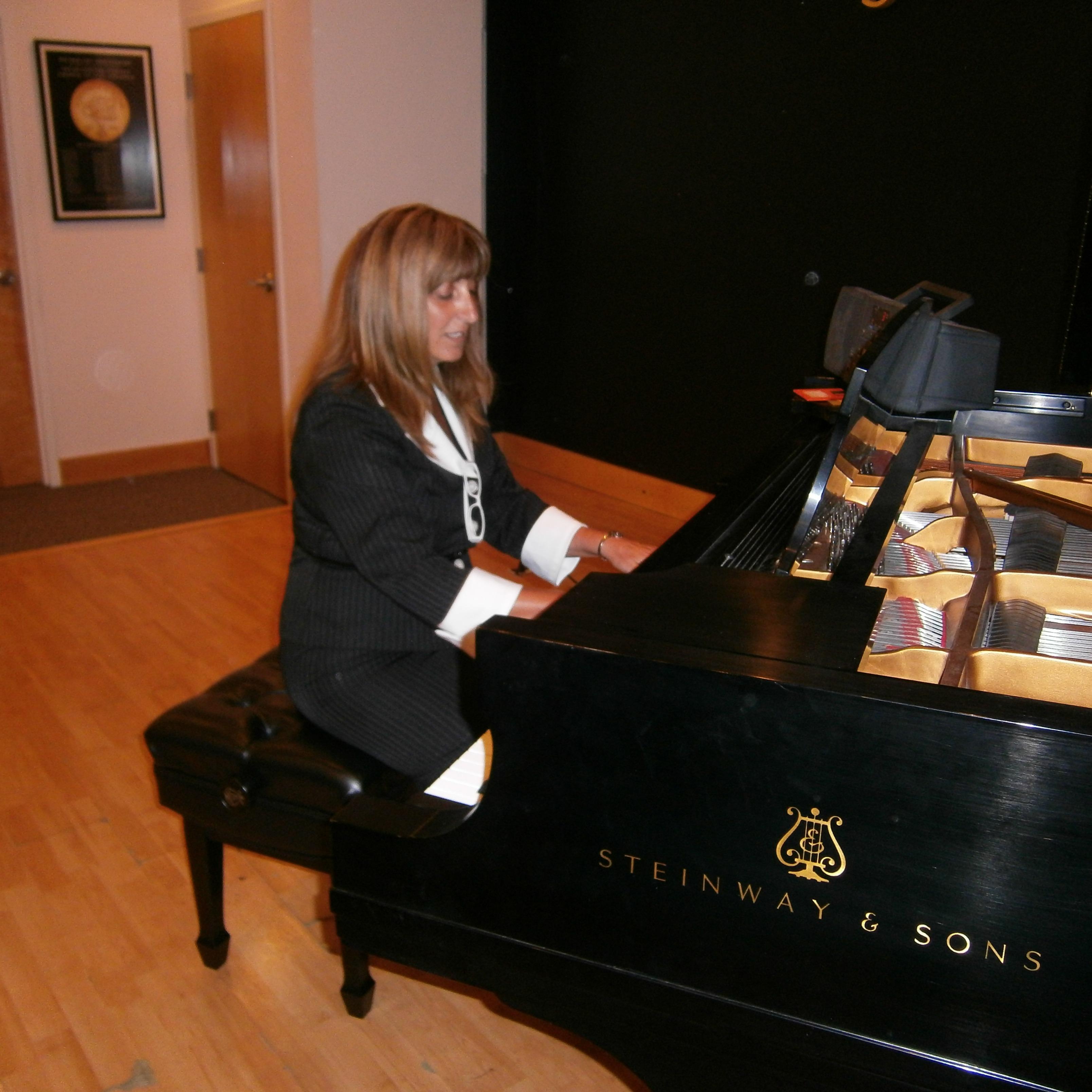 Piano and Guitar Lessons by Elizabeth Delicio MS, MA Logo