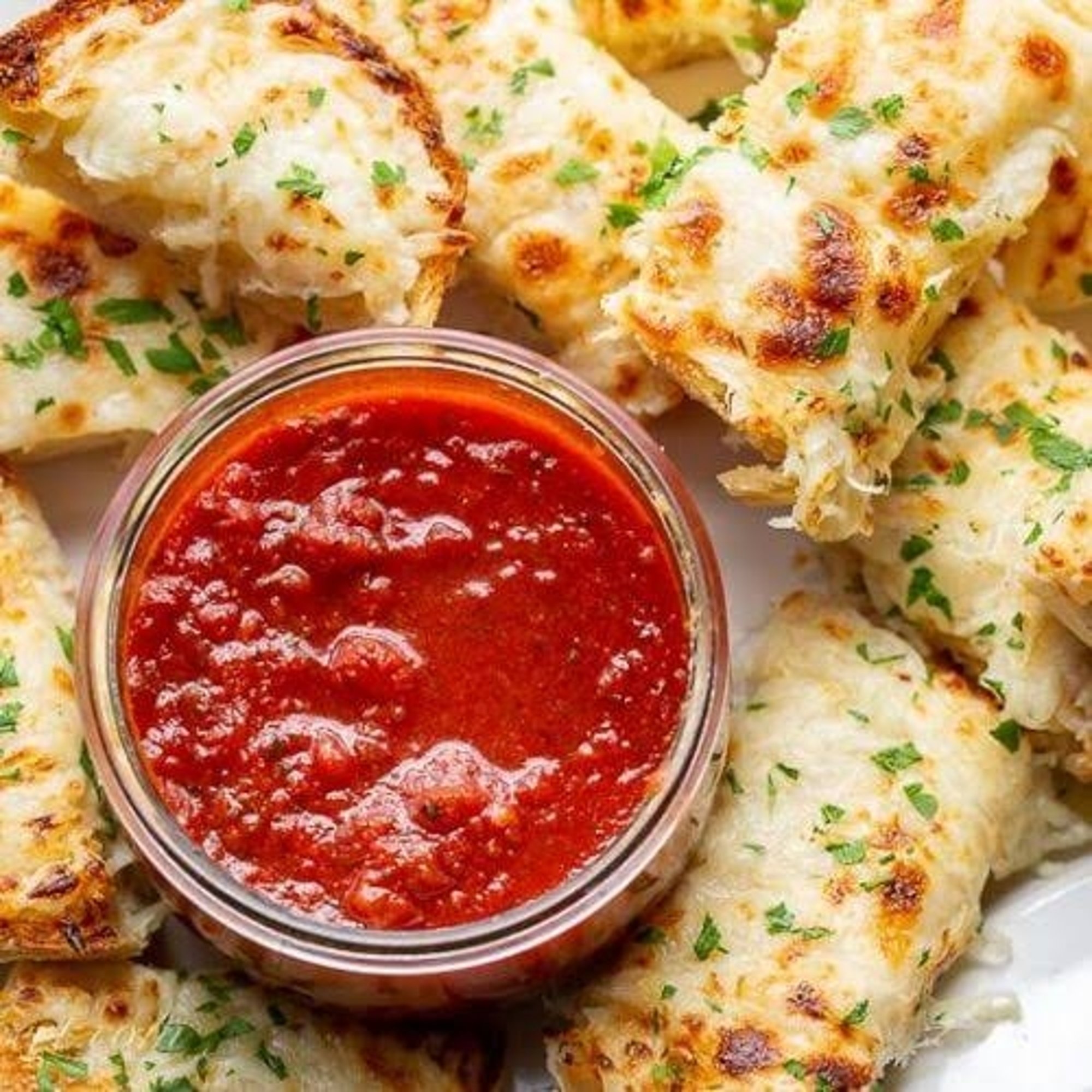 CHEESEBREAD our dough lightly baked with garlic butter, parmesan, seasonings, covered with edge t...