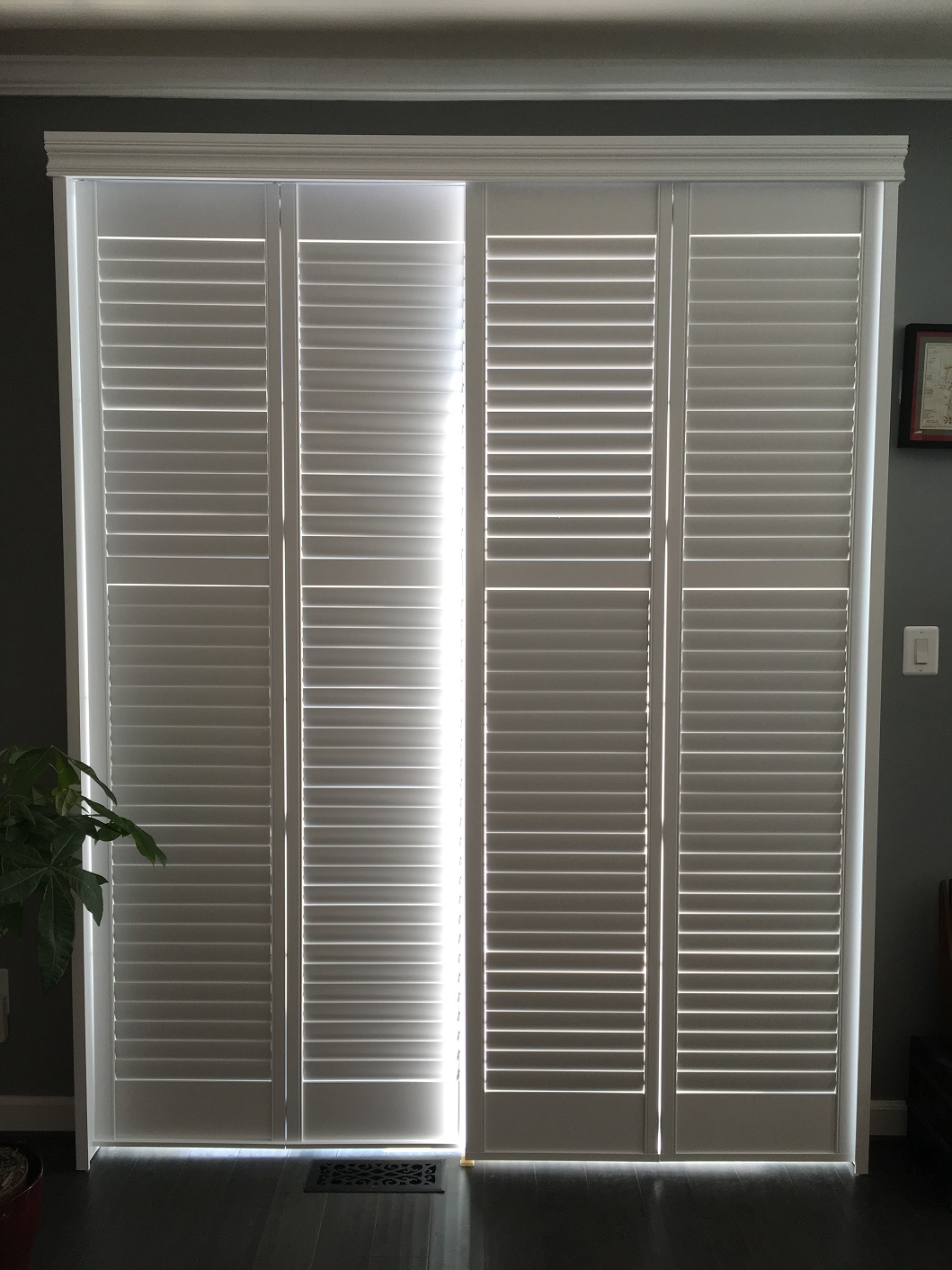 Bi-Fold Shutters by Budget Blinds of Fairfax create a welcoming environment for all who enter this home.