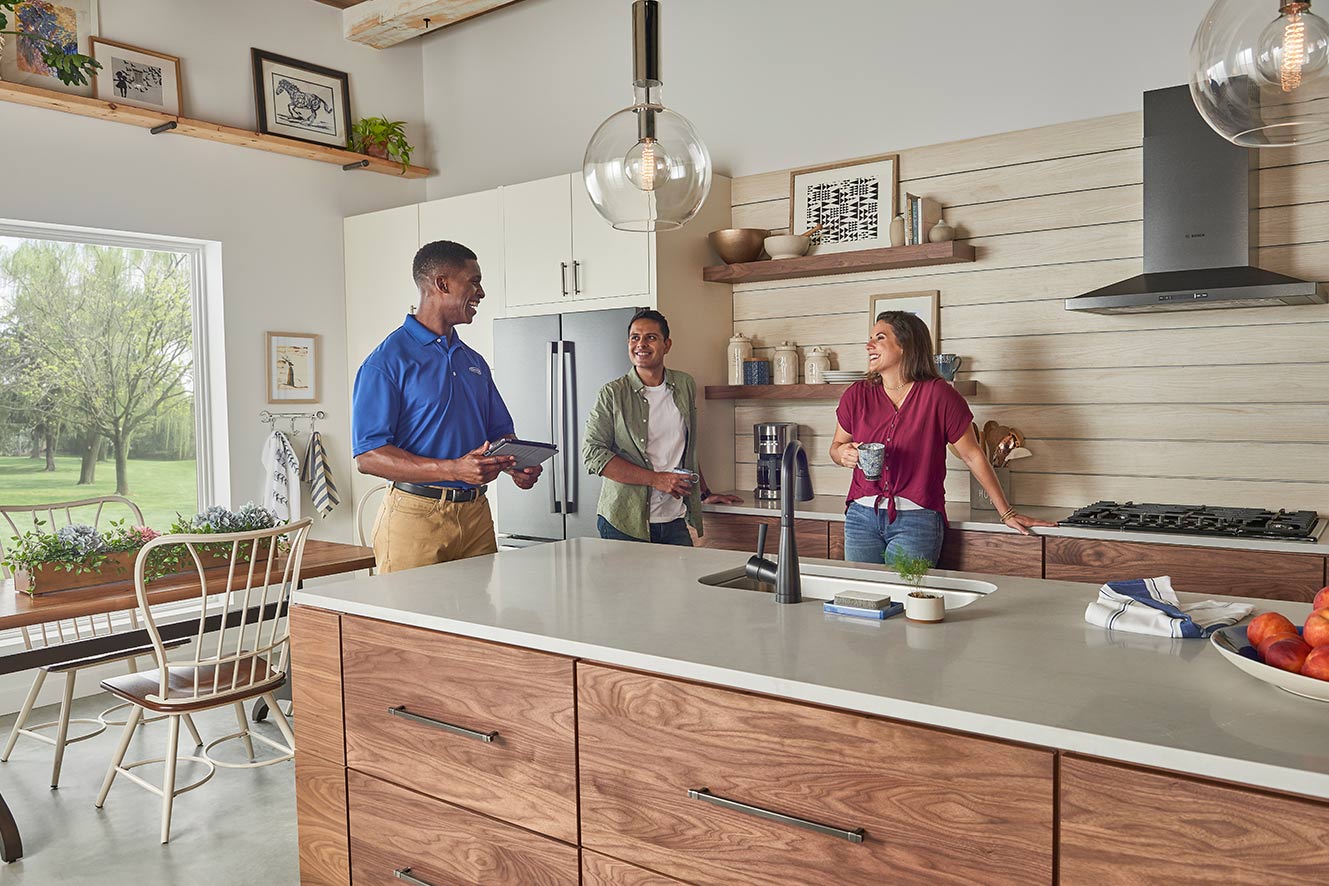 A Carrier expert providing a homeowner with an evaluation and estimate