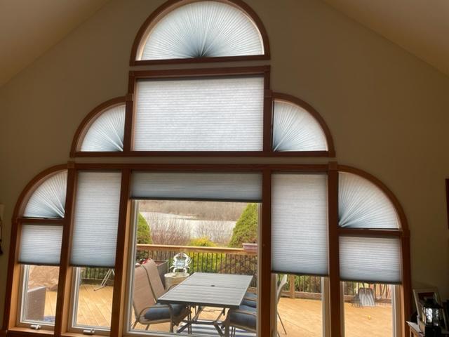 Look at this hard to fit beautiful window we just completed in Honesdale, PA. We used light filtering Cellular shades to cover this large window. Call Budget Blinds of Scranton for all your window covering needs!