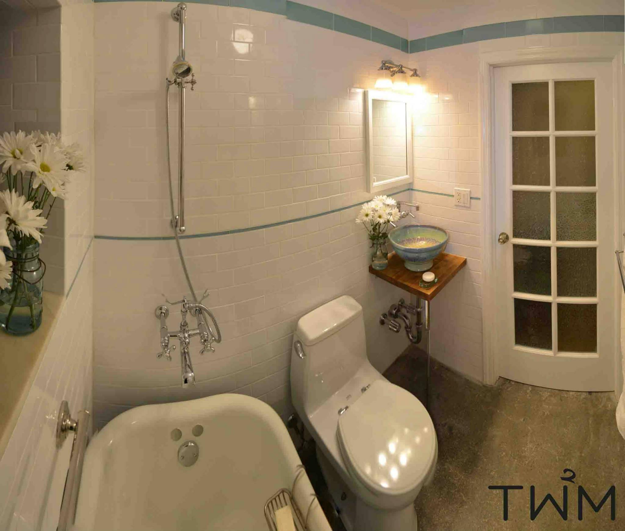 Tw2m was chosen to Design and Build a Reclaimed Vintage Bathroom. Claw foot tub, custom sink, reclaimed TOTO toilet, and custom door with reclaimed glass