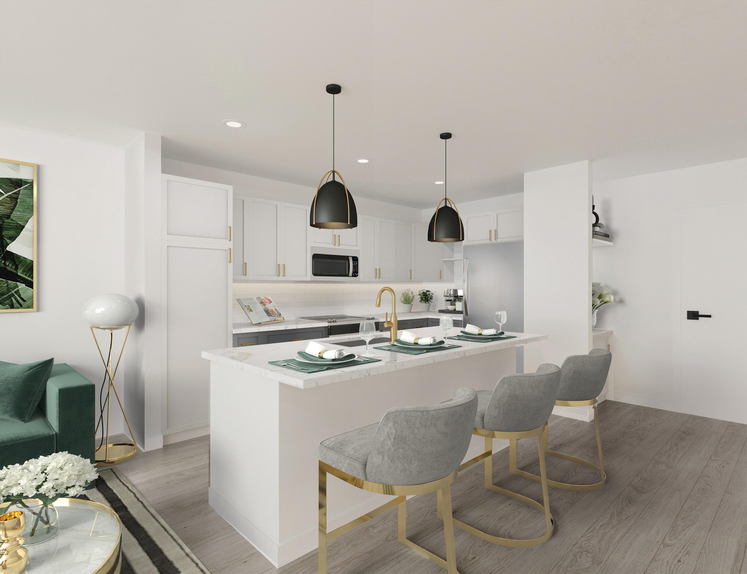 Kitchen with white upper cabinets, gray bottom cabinets, white countertops, and brushed brass hardware and accents at Camden Village District in Raleigh, NC