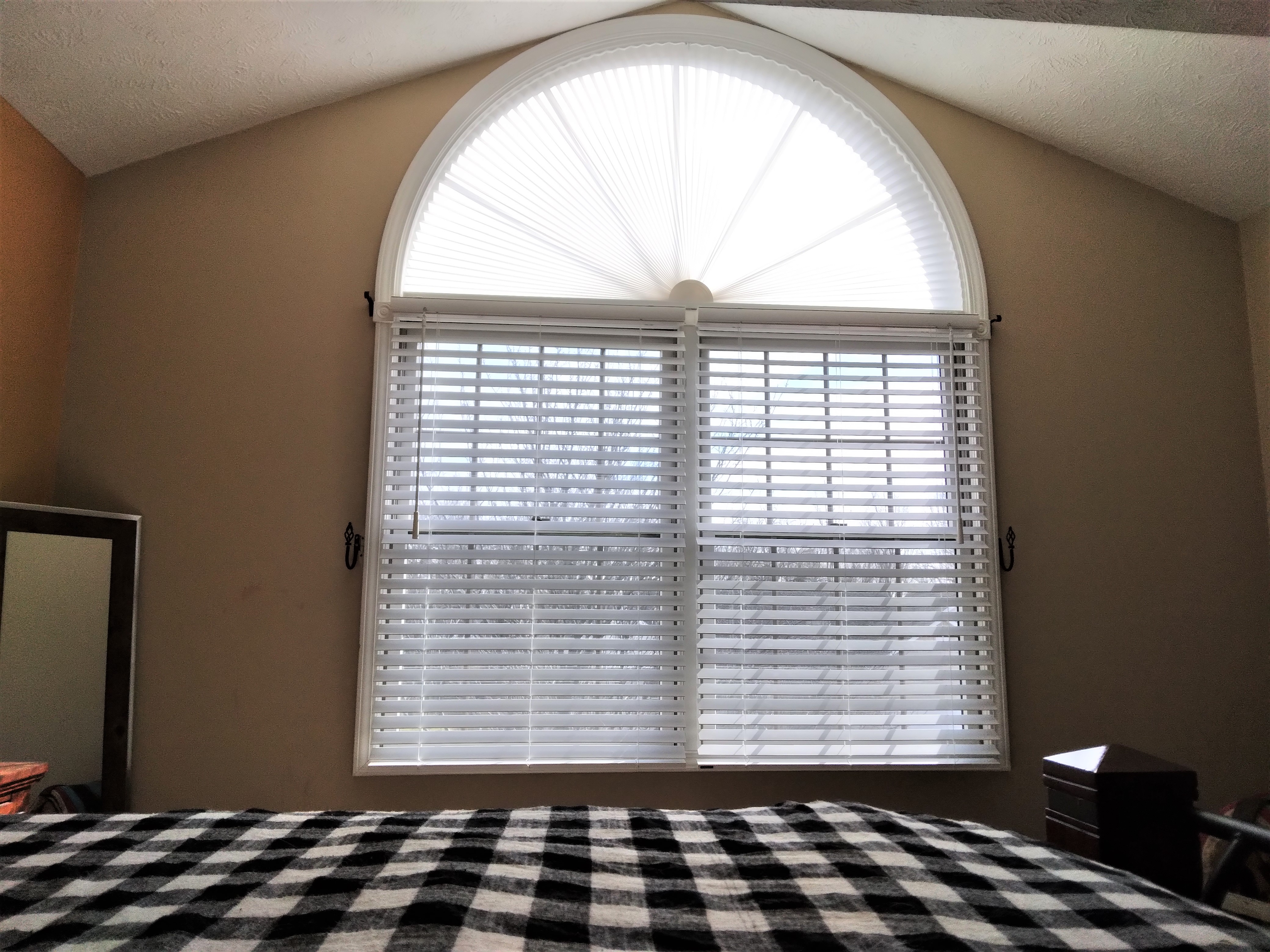 This pleated shade arch together with these faux wood blinds make the perfect window coverings combo for this bedroom window.  BudgetBlinds  WindowCoverings  Blinds  Shades  SpringfieldIllinois  Springfield