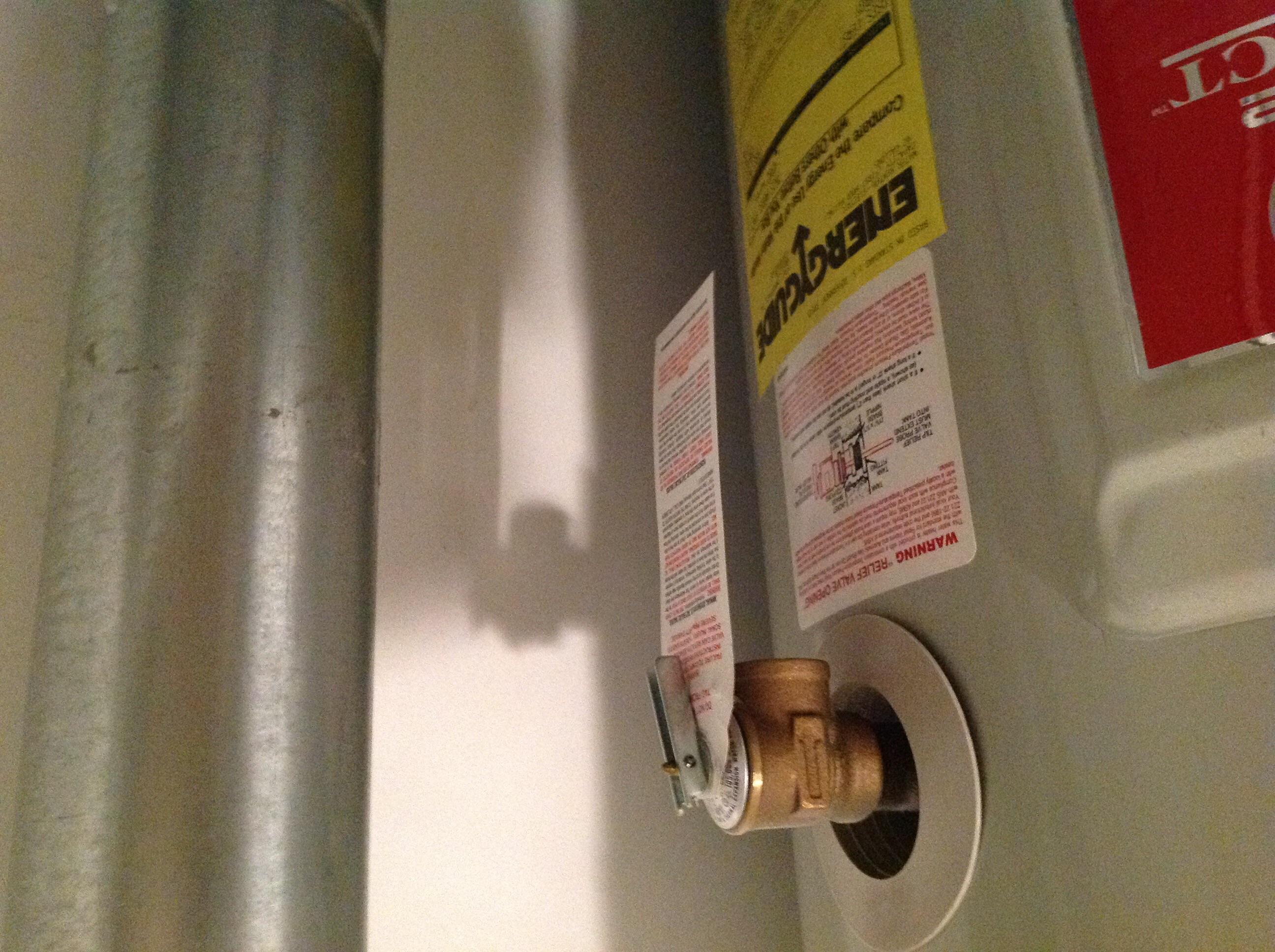 The Tpr valve on this water heater did not have a discharge pipe directing any hot water to the drip pan or a drain, found by Bumgardner inspection services in miamisburg Ohio 