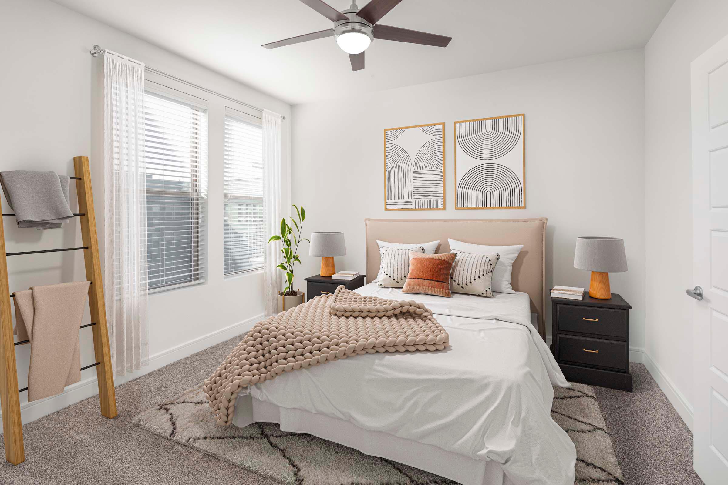 Flats bedroom with carpet and ceiling fan at Camden Greenville