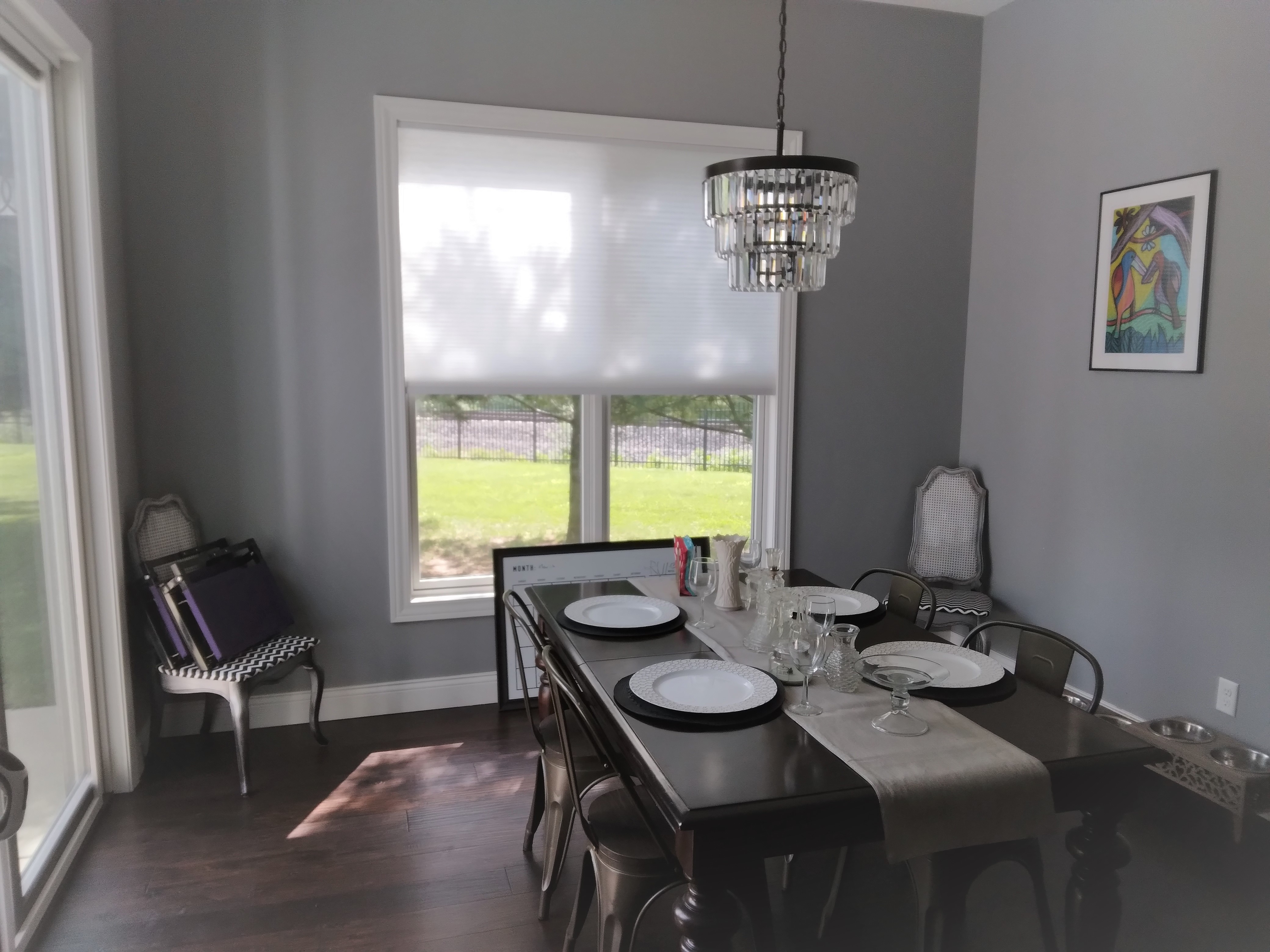 White cordless cellular shades in Springfield Illinois dining room.  BudgetBlinds  WindowCoverings  Shades  CellularShades  SpringfieldIllinois