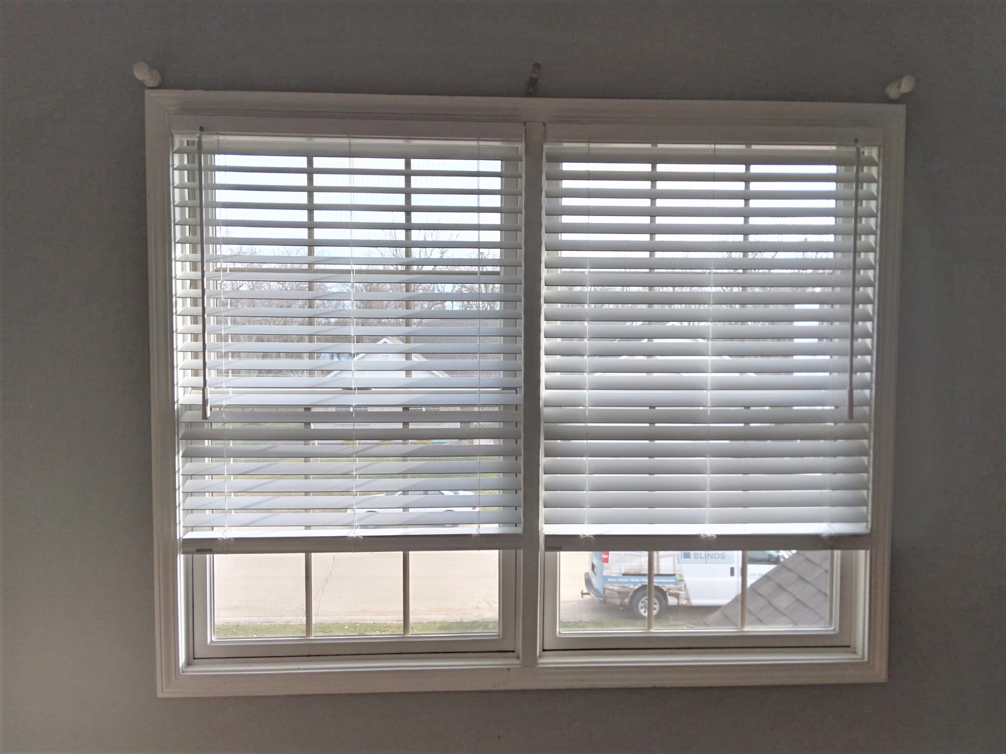 Faux wood blinds are the perfect option for this Springfield Illinois bedroom. Blinds allow the light to come in even when they are fully lowered. And the cordless option makes sure that they are safe for children and pets.  BudgetBlinds  Blinds  WindowCoverings  SpringfieldIllinois  Springfield